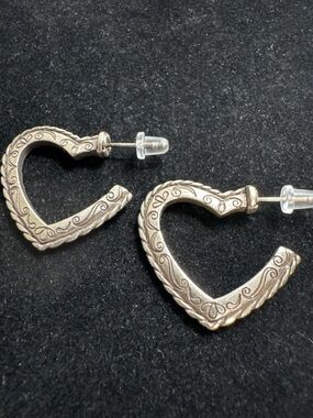 Brighton-style silver scroll heart dangle earrings, intricate engraved designs.